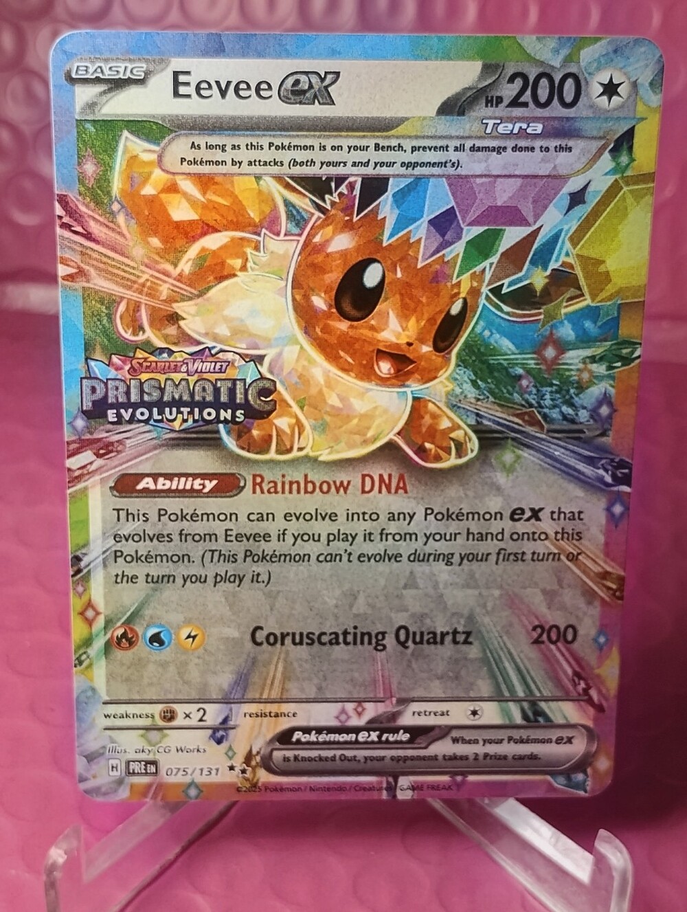 Eevee ex Prismatic Evolutions Holographic Pokémon Card - Rainbow DNA Promo